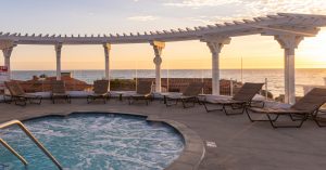 Carlsbad Inn Beach Resort adult hot tub sunset feature image